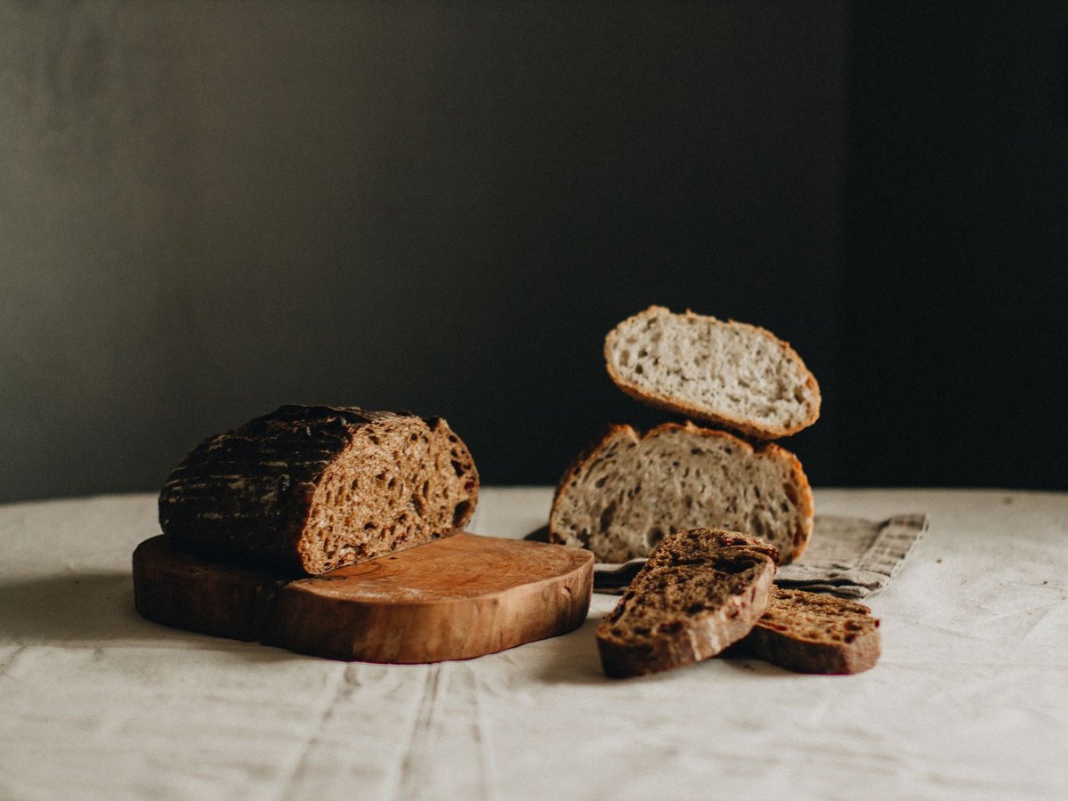 Artisan sourdough bread loaves on a wooden board