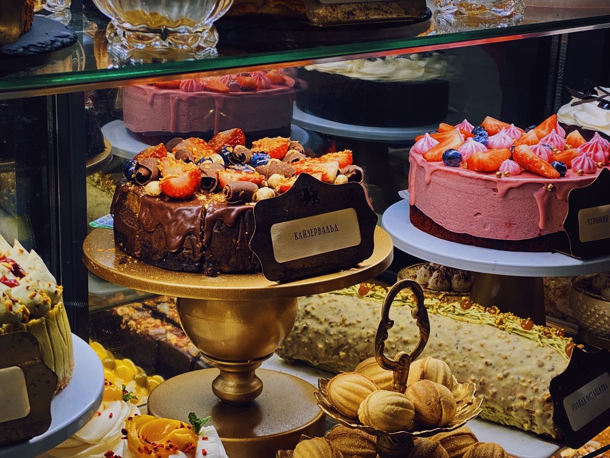 Assorted cakes and pastries in a display case