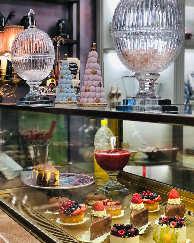 Celebration cakes displayed in a patisserie cabinet