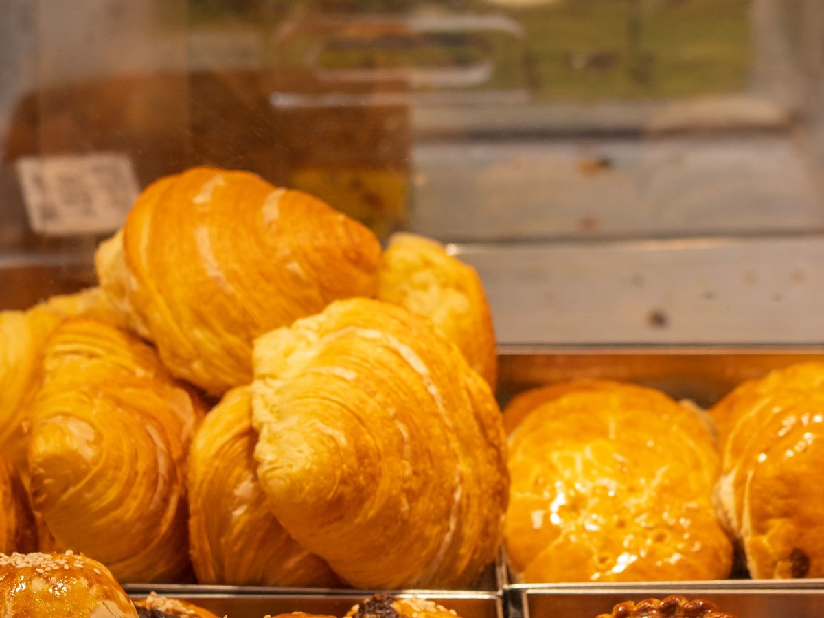 Freshly baked croissants on a tray