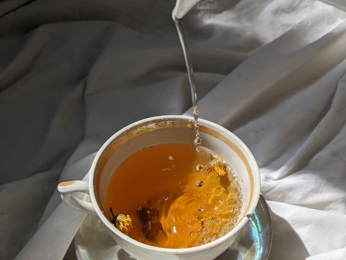 Tea being poured into a cup